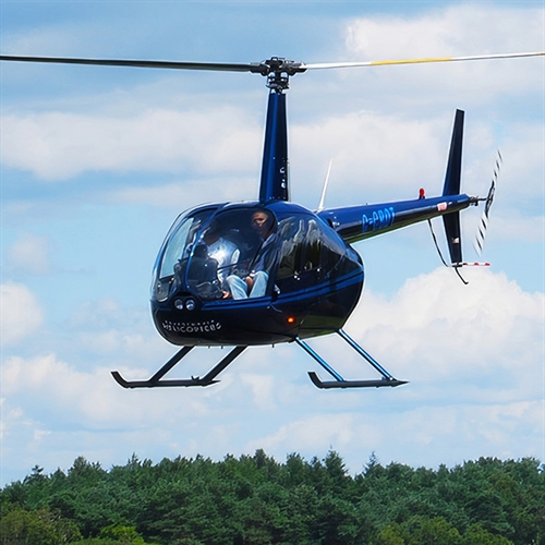 Helicopter Lessons Bournemouth - Man at Helicopter Controls Helicopter Lessons Bournemouth - Man at Helicopter Controls